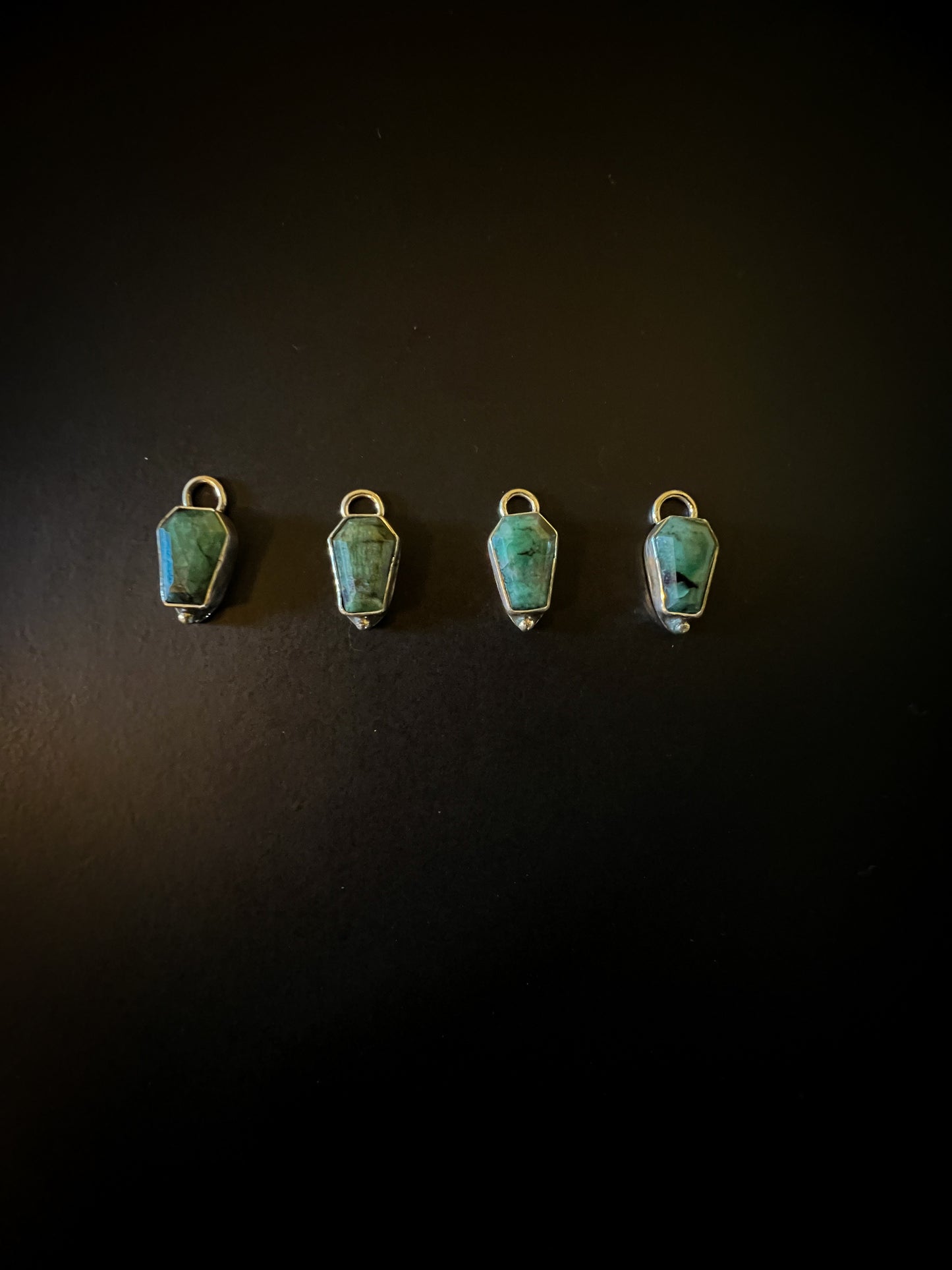 Emerald coffin charms
