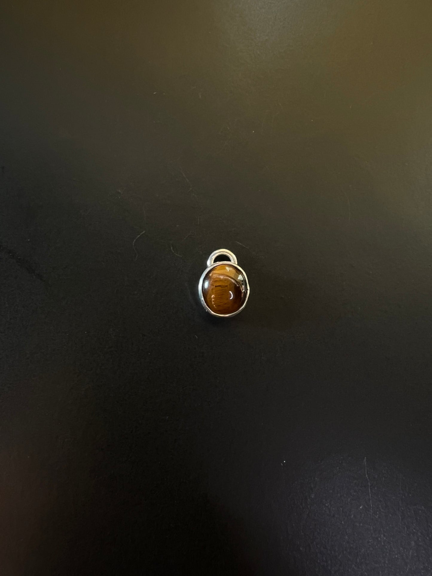 Tiger’s eyes charms
