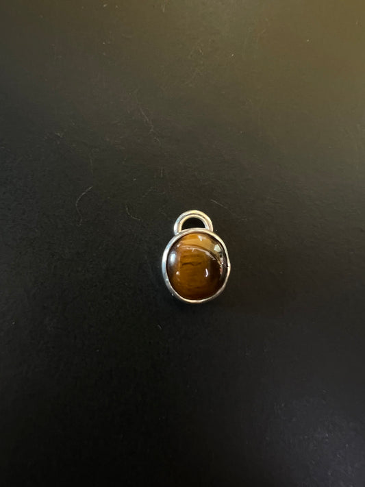Tiger’s eyes charms